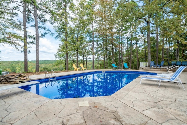 pool with a patio area