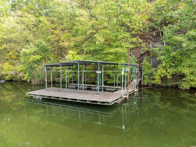 dock area with a water view and a forest view