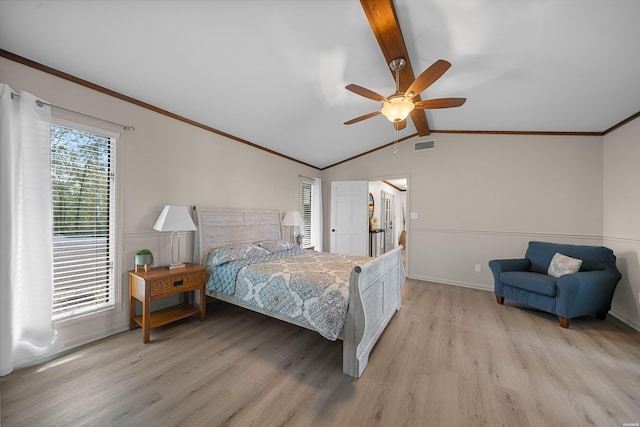 bedroom with lofted ceiling with beams, light wood-style floors, multiple windows, and visible vents