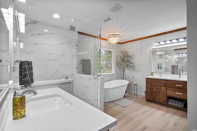 bathroom with vanity, wood finished floors, a marble finish shower, and visible vents