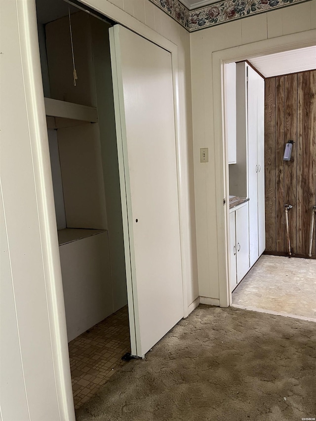 811 N 1st St, Glenwood, AR 71943 - hall featuring carpet and wooden walls