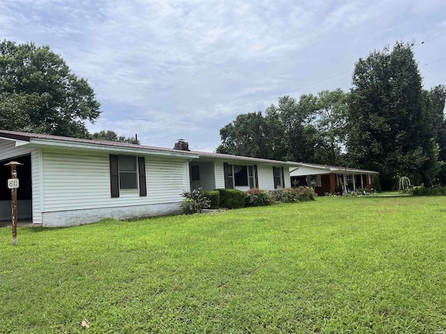 811 N 1st St, Glenwood, AR 71943 - view of front of home with a front yard and a chimney