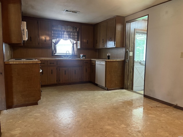 811 N 1st St, Glenwood, AR 71943 - kitchen with dishwasher, light floors, and light countertops