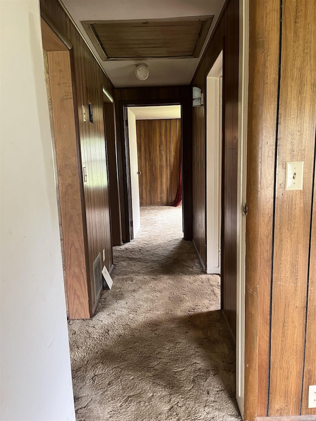 811 N 1st St, Glenwood, AR 71943 - corridor with carpet flooring and wood walls