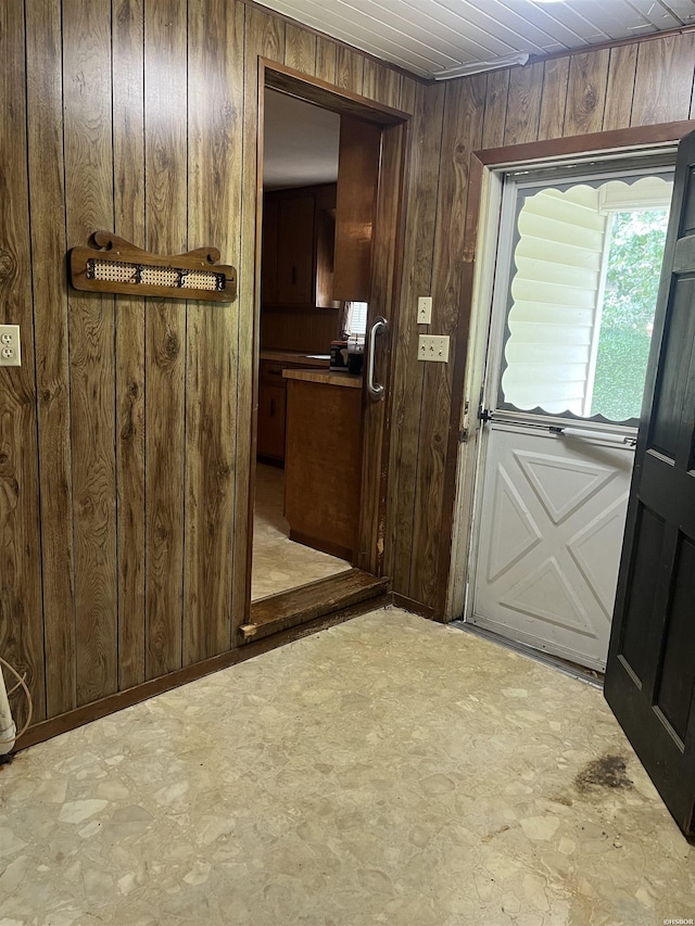 811 N 1st St, Glenwood, AR 71943 - entryway with wood walls and tile patterned floors