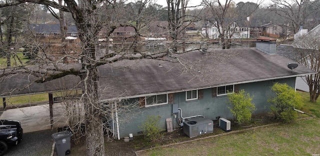 189 Bayshore Cv, Hot Springs, AR 71913 - exterior space featuring brick siding, roof with shingles, a chimney, and cooling unit