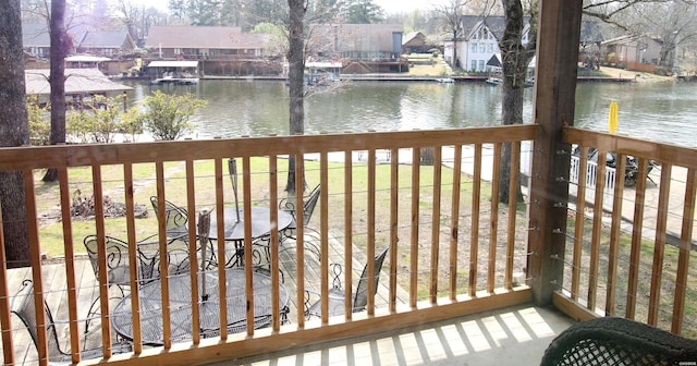 189 Bayshore Cv, Hot Springs, AR 71913 - wooden terrace with a lawn, a water view, and a residential view