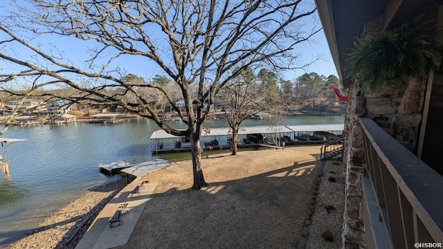 exterior space featuring a water view and a boat dock