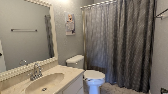 full bath with tile patterned flooring, a shower with shower curtain, vanity, and toilet