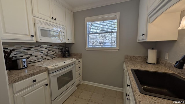 kitchen with tasteful backsplash, ornamental molding, white cabinets, a sink, and white appliances