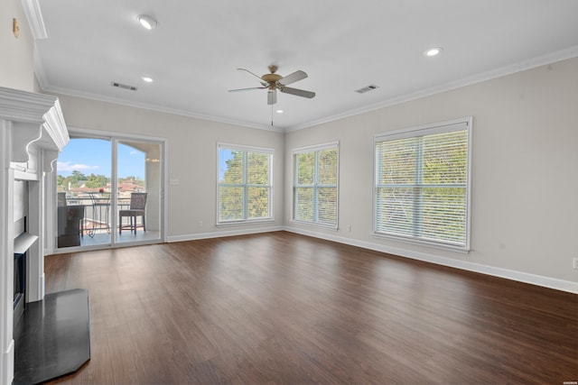 unfurnished living room featuring baseboards, crown molding, visible vents, and dark wood-type flooring