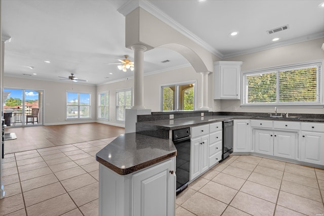 kitchen featuring ornate columns, visible vents, white cabinetry, and open floor plan