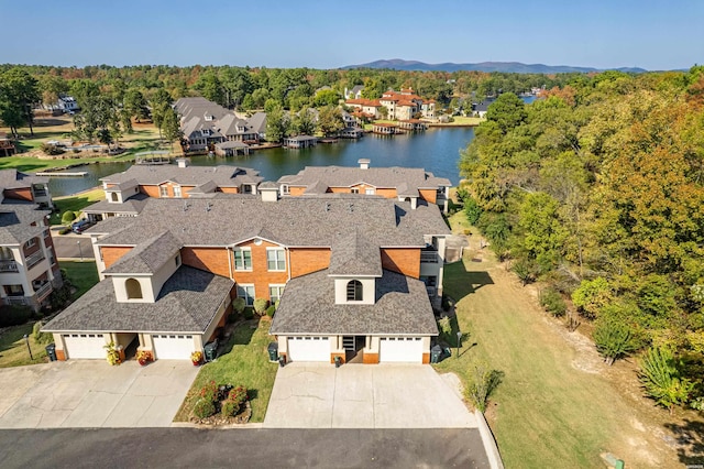 bird's eye view featuring a water view and a residential view