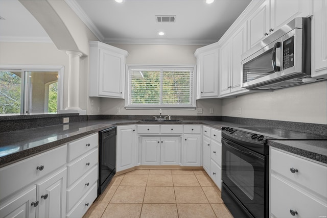 kitchen with white cabinetry, crown molding, visible vents, and black appliances