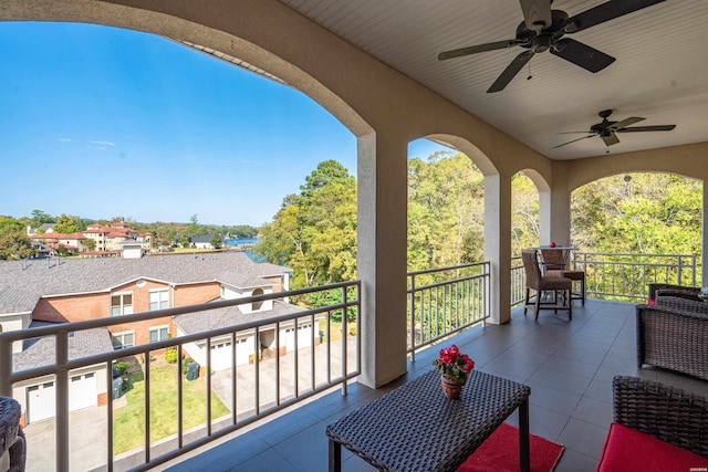 balcony with ceiling fan and a residential view