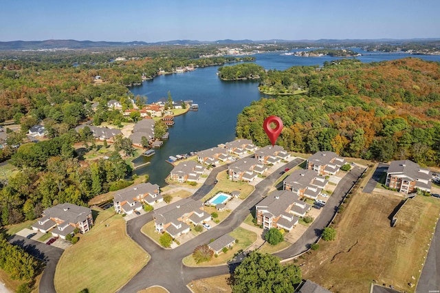 aerial view with a water view, a residential view, and a view of trees