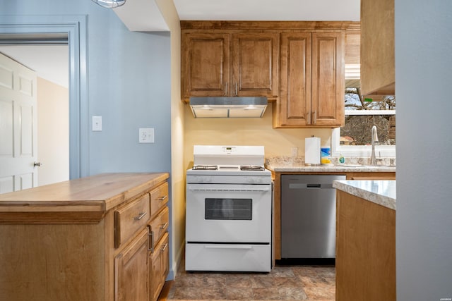 kitchen with brown cabinets, gas range gas stove, stainless steel dishwasher, a sink, and under cabinet range hood