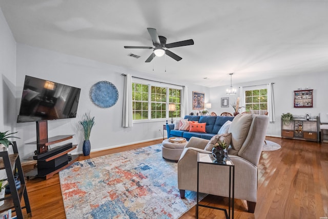 206 Shawnee St, Hot Springs, AR 71901 - living area featuring wood finished floors, a chandelier, a ceiling fan, and baseboards