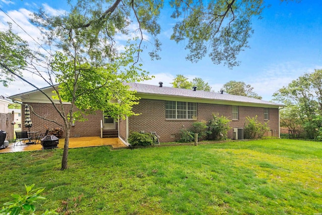 206 Shawnee St, Hot Springs, AR 71901 - rear view of property featuring a patio area, a lawn, central air condition unit, brick siding, and crawl space