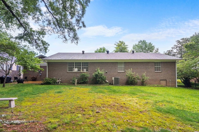 206 Shawnee St, Hot Springs, AR 71901 - rear view of house featuring a yard, central air condition unit, and brick siding