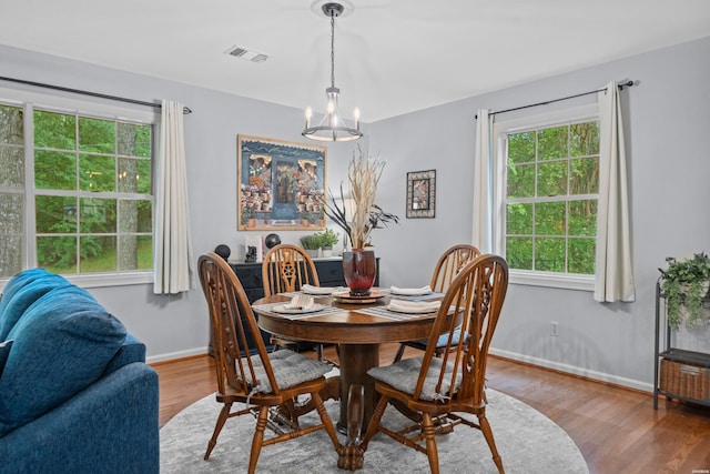206 Shawnee St, Hot Springs, AR 71901 - dining area with a chandelier, healthy amount of natural light, and wood finished floors