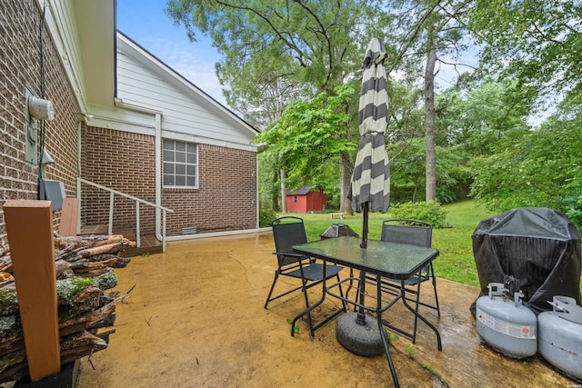206 Shawnee St, Hot Springs, AR 71901 - view of patio with outdoor dining space, grilling area, an outdoor structure, and a shed