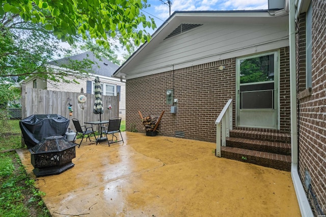 206 Shawnee St, Hot Springs, AR 71901 - view of patio with entry steps, an outdoor fire pit, fence, and area for grilling