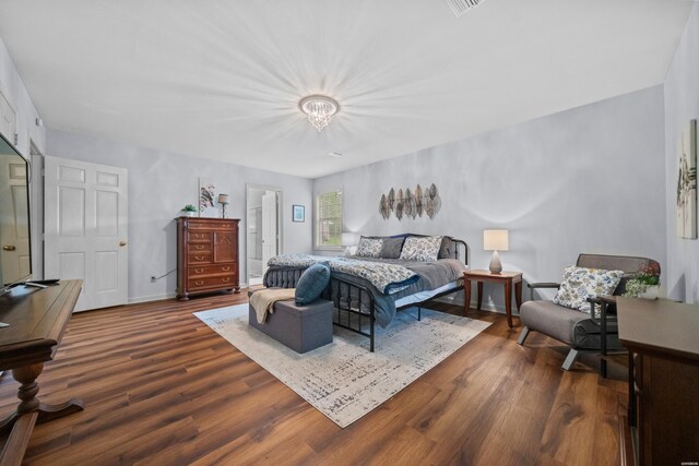 206 Shawnee St, Hot Springs, AR 71901 - bedroom with wood finished floors, a chandelier, and baseboards