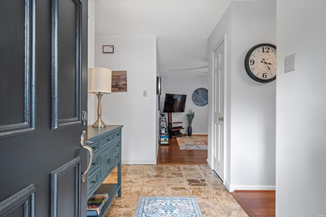 206 Shawnee St, Hot Springs, AR 71901 - foyer featuring baseboards and light stone finish flooring
