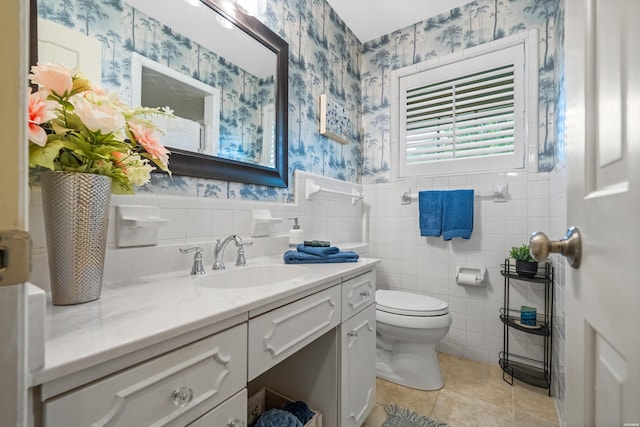 206 Shawnee St, Hot Springs, AR 71901 - bathroom featuring wallpapered walls, tile patterned flooring, toilet, vanity, and wainscoting