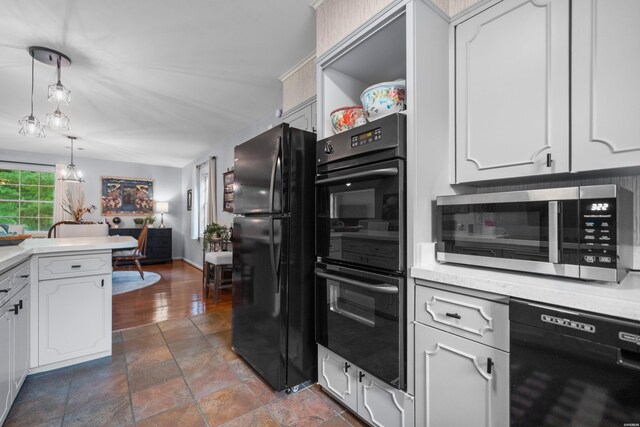 206 Shawnee St, Hot Springs, AR 71901 - kitchen with black appliances, white cabinetry, light countertops, and pendant lighting