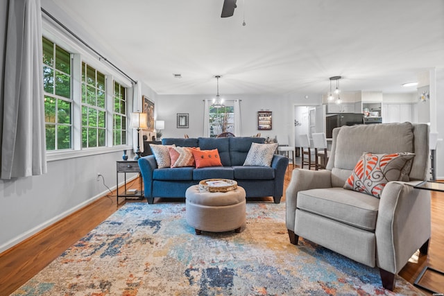 206 Shawnee St, Hot Springs, AR 71901 - living room with wood finished floors, baseboards, and a ceiling fan