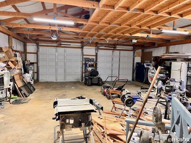 906 Surrey Rd, Hot Springs, AR 71909 - garage featuring a garage door opener