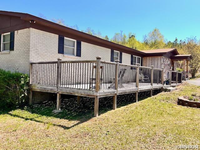 906 Surrey Rd, Hot Springs, AR 71909 - rear view of property featuring a lawn and a wooden deck