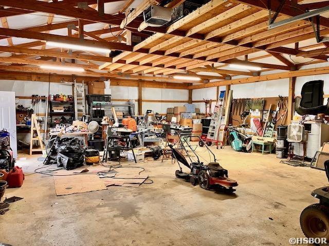 906 Surrey Rd, Hot Springs, AR 71909 - garage featuring a garage door opener
