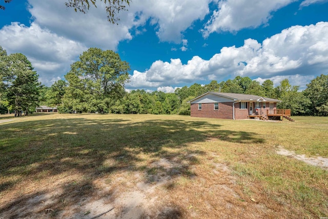 1526 Pearcy Rd, Pearcy, AR 71964 - view of grassy yard featuring a wooden deck and a forest view