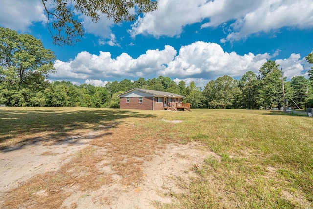 1526 Pearcy Rd, Pearcy, AR 71964 - view of grassy yard featuring a wooden deck and a forest view