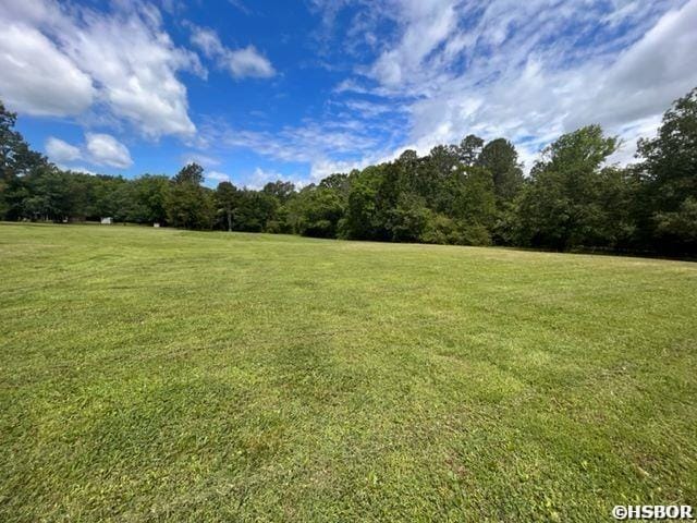 1526 Pearcy Rd, Pearcy, AR 71964 - view of green lawn featuring a wooded view