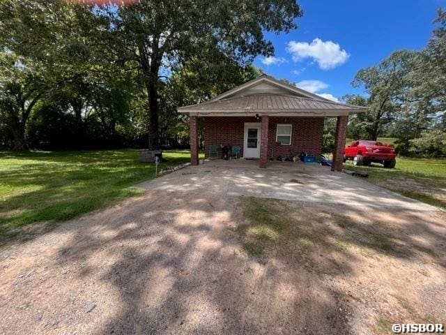 1526 Pearcy Rd, Pearcy, AR 71964 - view of property exterior featuring a yard