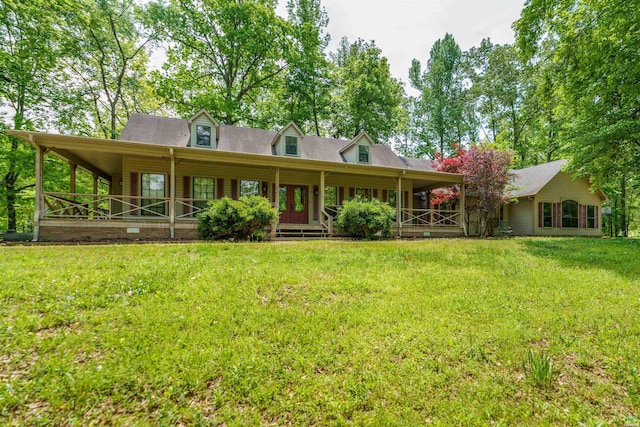 back of property featuring a lawn and covered porch