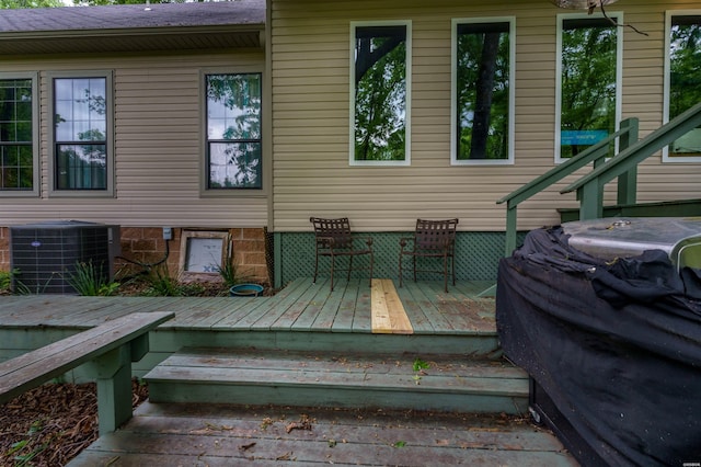 exterior space with central air condition unit and area for grilling