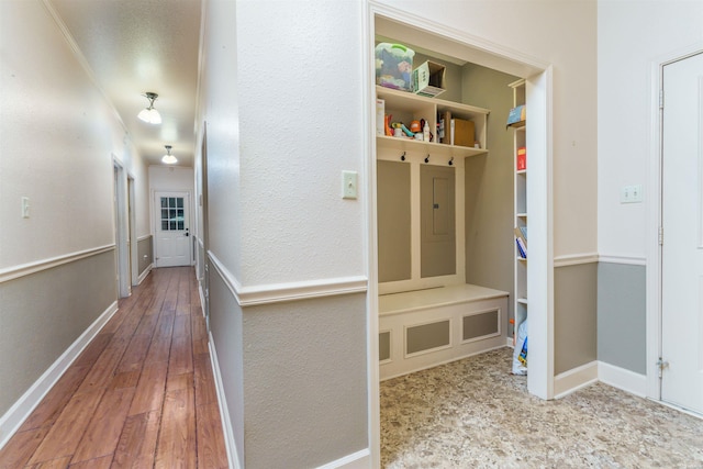 mudroom featuring wood-type flooring and baseboards