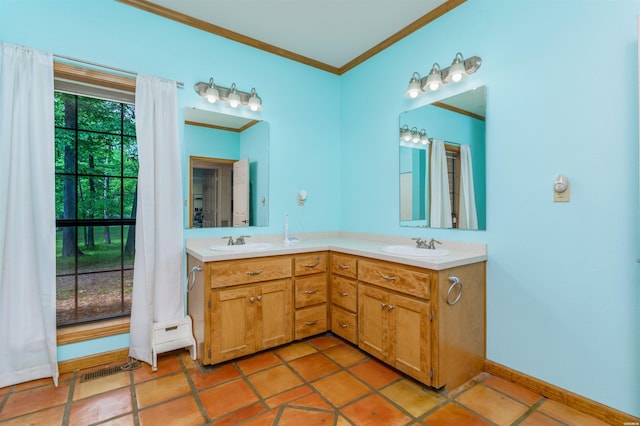 full bathroom with a sink, ornamental molding, double vanity, and visible vents