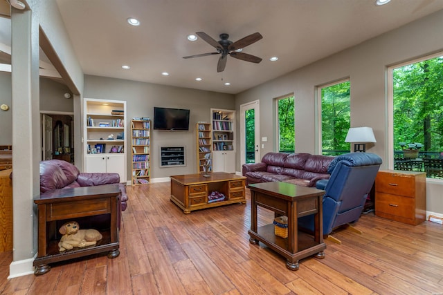 living room with recessed lighting, light wood-style flooring, ceiling fan, and built in features