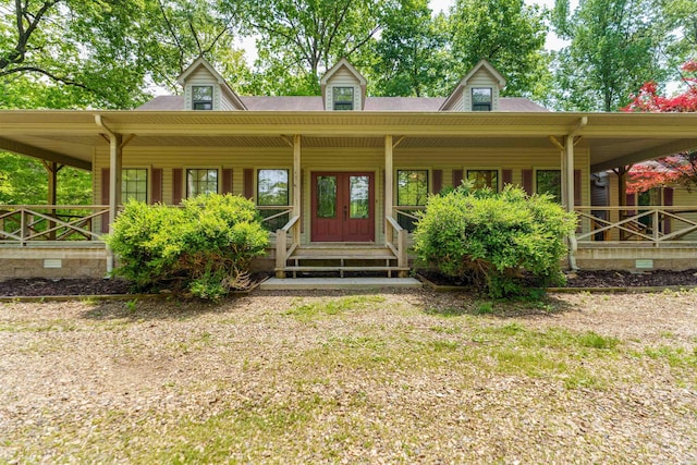 view of exterior entry featuring a porch