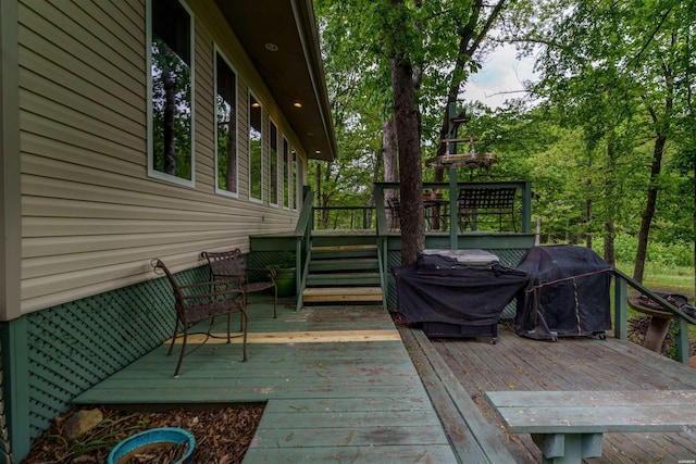 wooden deck featuring area for grilling