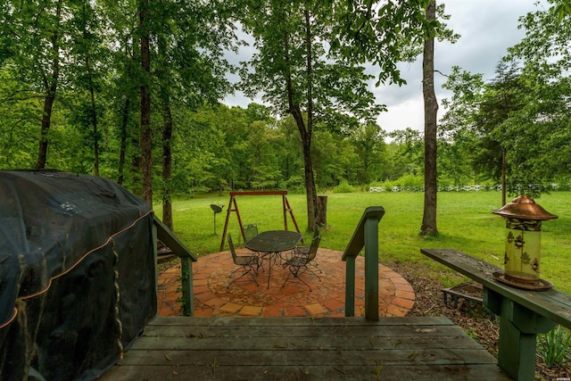 exterior space with outdoor dining area, a yard, and area for grilling