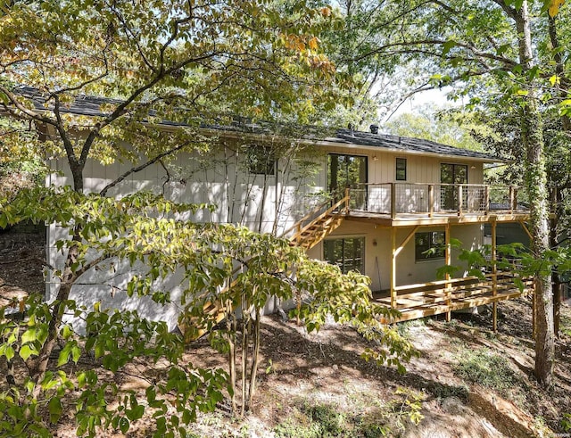 rear view of house with a wooden deck