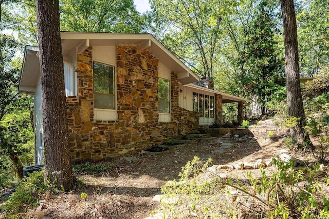 view of home's exterior with stone siding