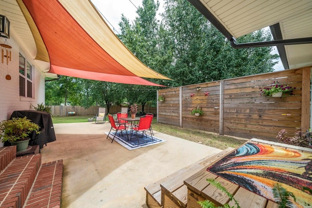 624 Ridgeway St, Hot Springs, AR 71901 - fenced backyard with a patio area, outdoor dining area, and a grill